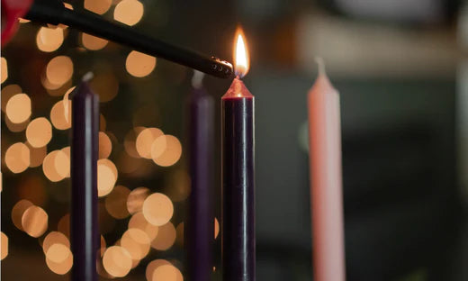 Candle being lit by a lighter