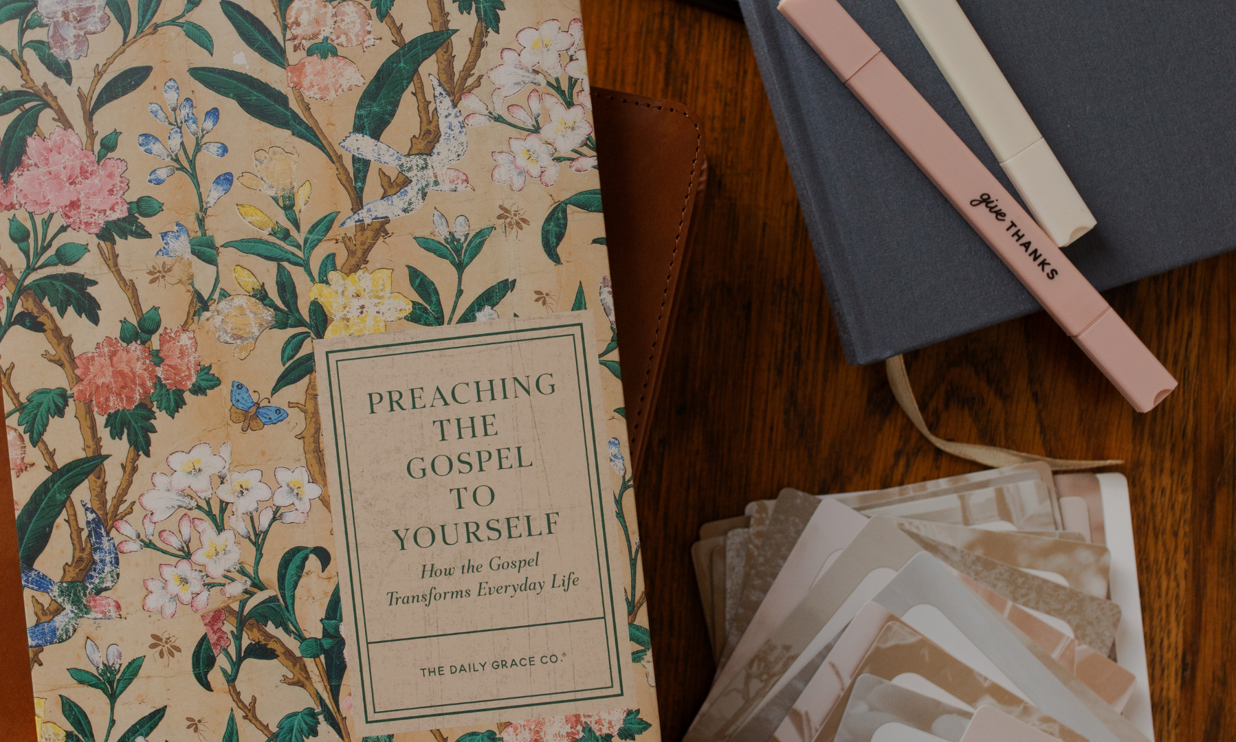 The Preaching the Gospel to Yourself study near some highlighters on a wooden table