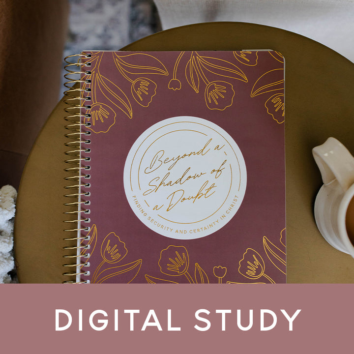 A bible study sitting on a table next to a coffee mug with the banner that says Digital Study on it.