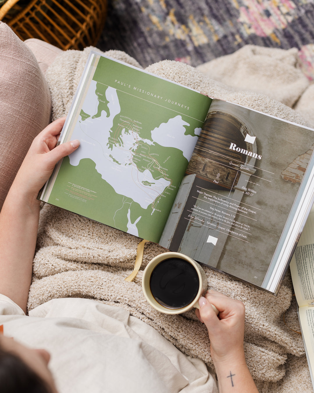 Woman holding handbook open to pages of map and book title of the Bible