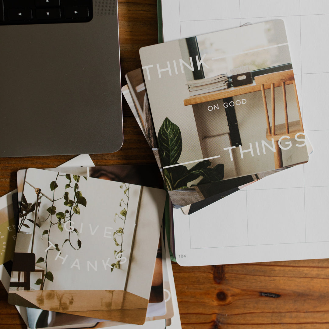 Rounded Edges Encouragement for the Workplace Verse Cards split into two piles on a calendar and next to a keyboard