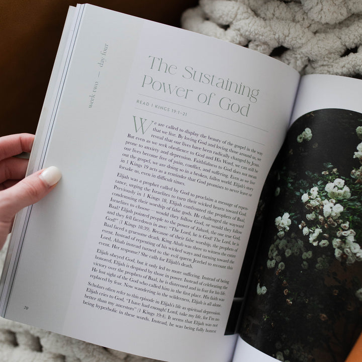 It Is Well Study opened to The Sustaining Power of God page; The study is resting on a white knitted blanket