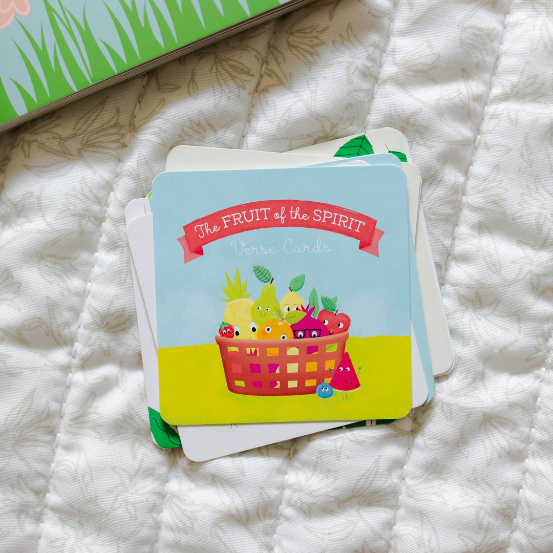 Rounded Fruit of the Spirit verse cards laying on blanket