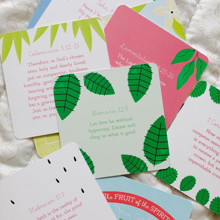 Back of the Fruit of the Spirit Verse Cards with Scripture verses all laid out on a blanket