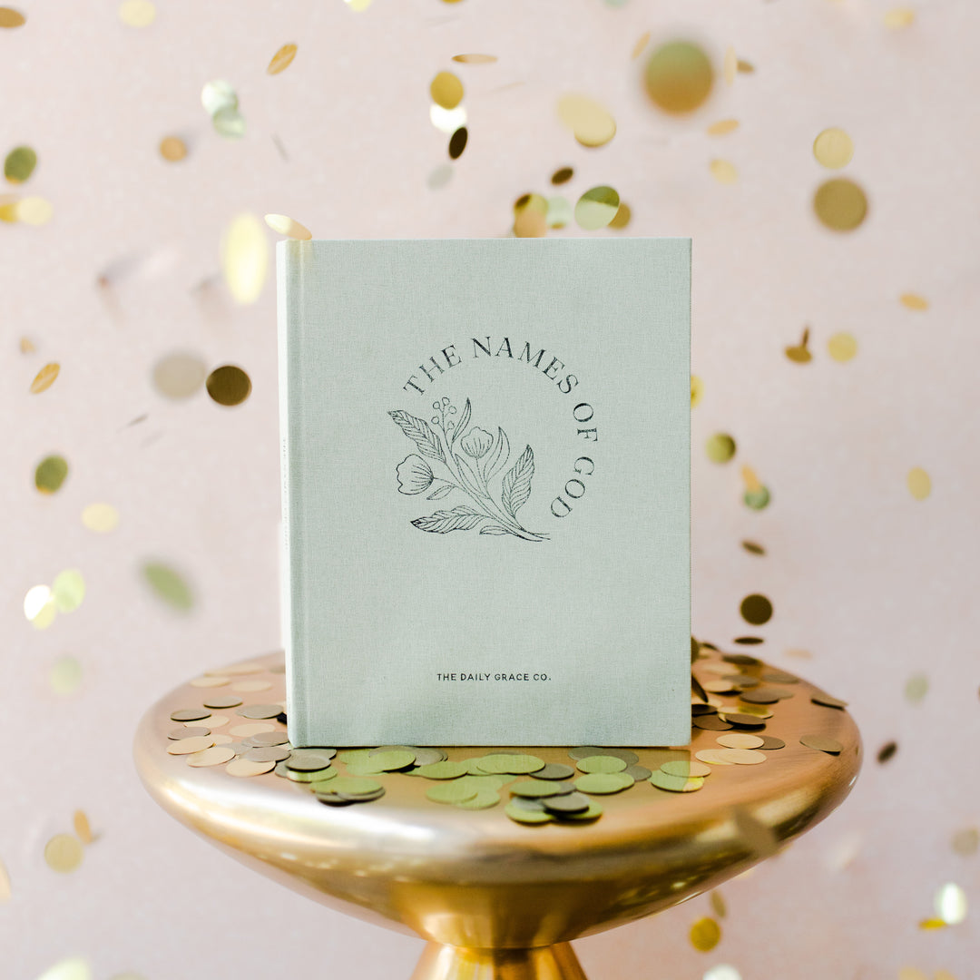 Coffee table book on gold table with gold confetti