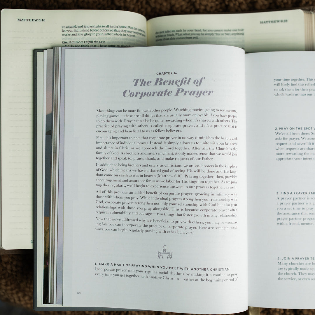 The Prayer Handbook opened to the The Benefit of Corporate Prayer on Chapter 14 on a open bible on a brown knitted blanket