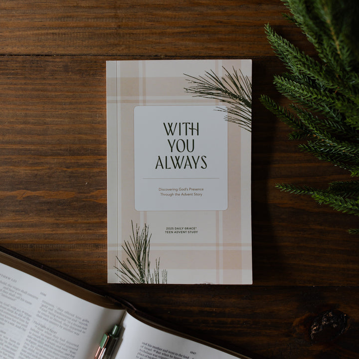 With you Always Teen Advent Study cover on a wooden table next to some greenery
