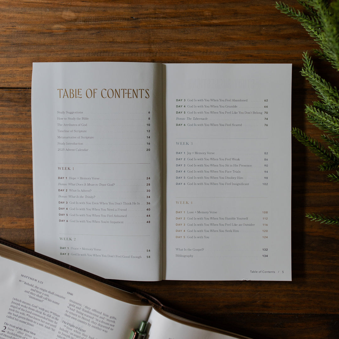 With you Always Teen Advent Study opened to the Table of Contents on a wooden table next to some greenery