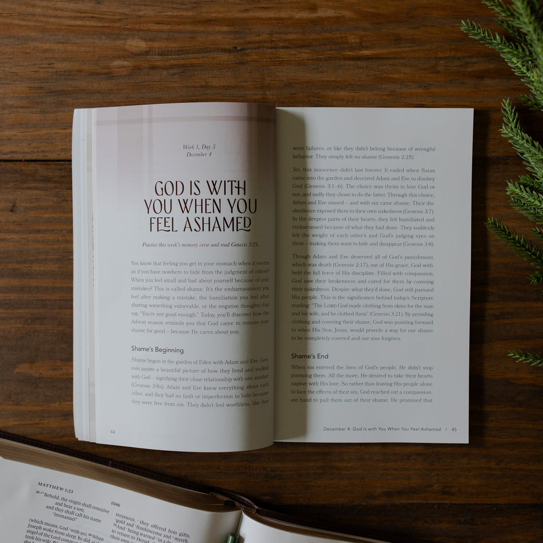 With you Always Teen Advent Study opened to the God is With you when you feel ashamed page on a wooden table next to some greenery