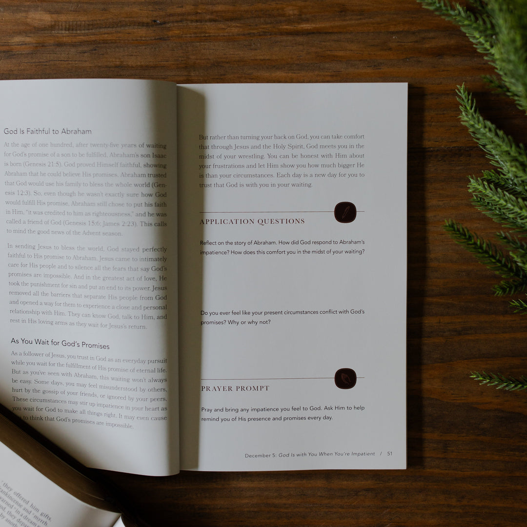 With you Always Teen Advent Study opened to an application questions page on a wooden table next to some greenery