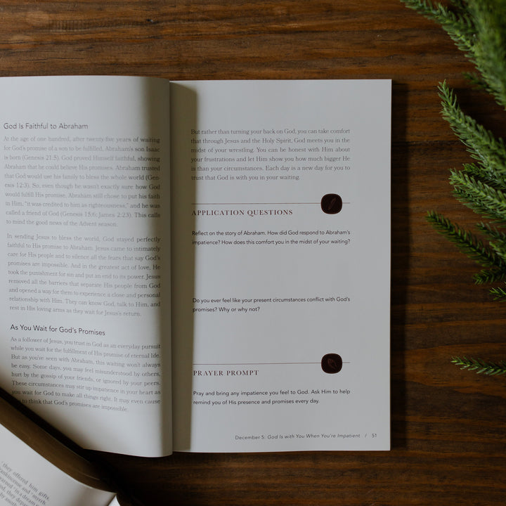 With you Always Teen Advent Study opened to an application questions page on a wooden table next to some greenery