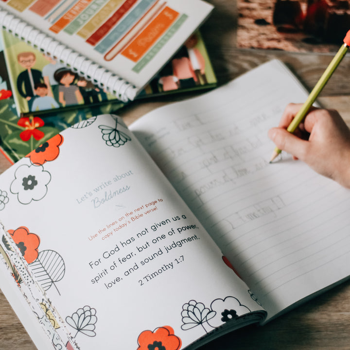 My Scripture Workbook: Bible Verses about Character is about to an activity page dedicated to Boldness with a child completing an activity with a pencil in their hand on the table.