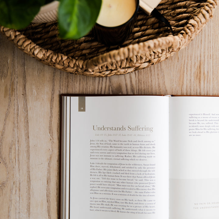 devotional opened to writing on table next to tray