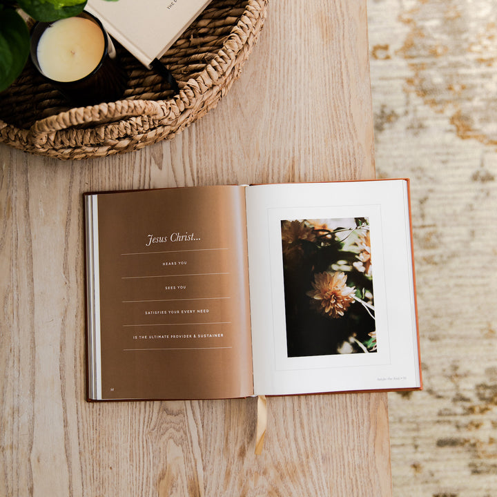devotional opened to photo and writing on table