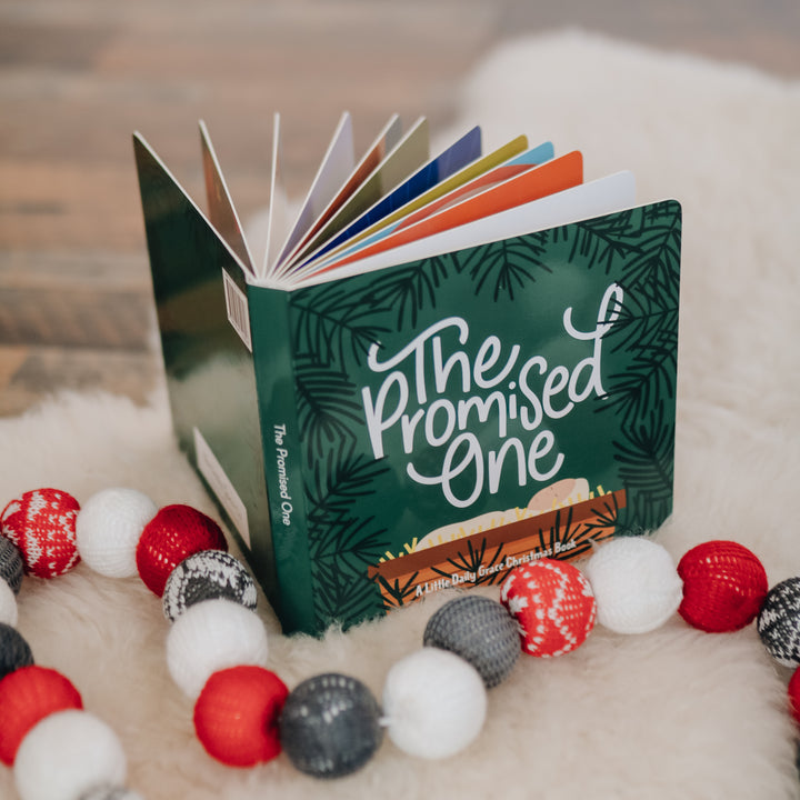 photo of book sitting up with garland around it