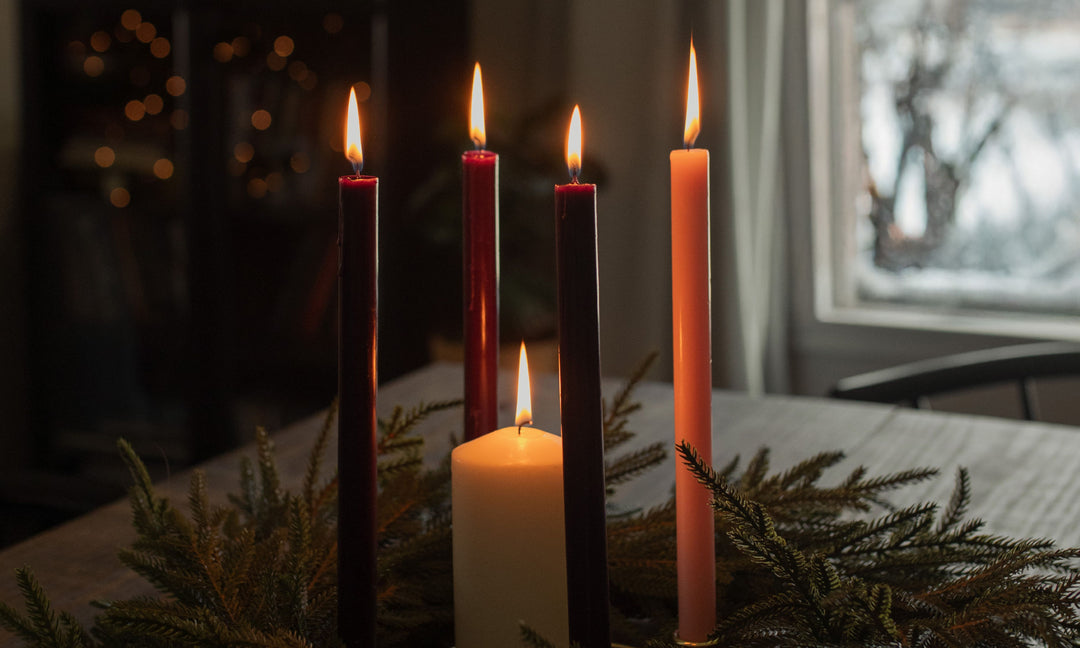 5 Candles on a wooden table