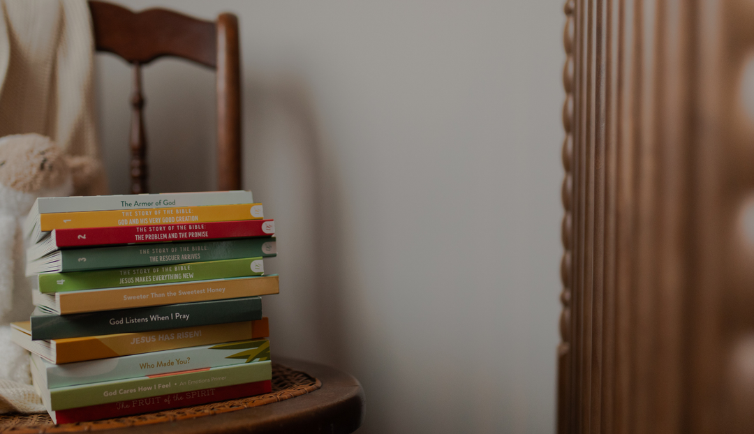 A stack of children's books on a chair