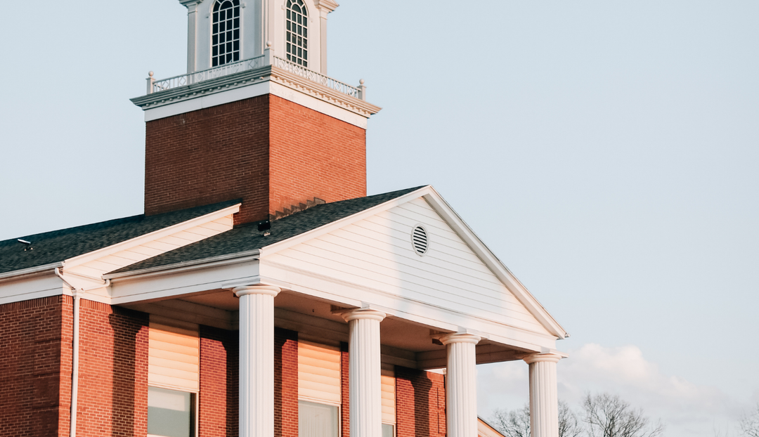A church in the sunset with a clear blue sky background