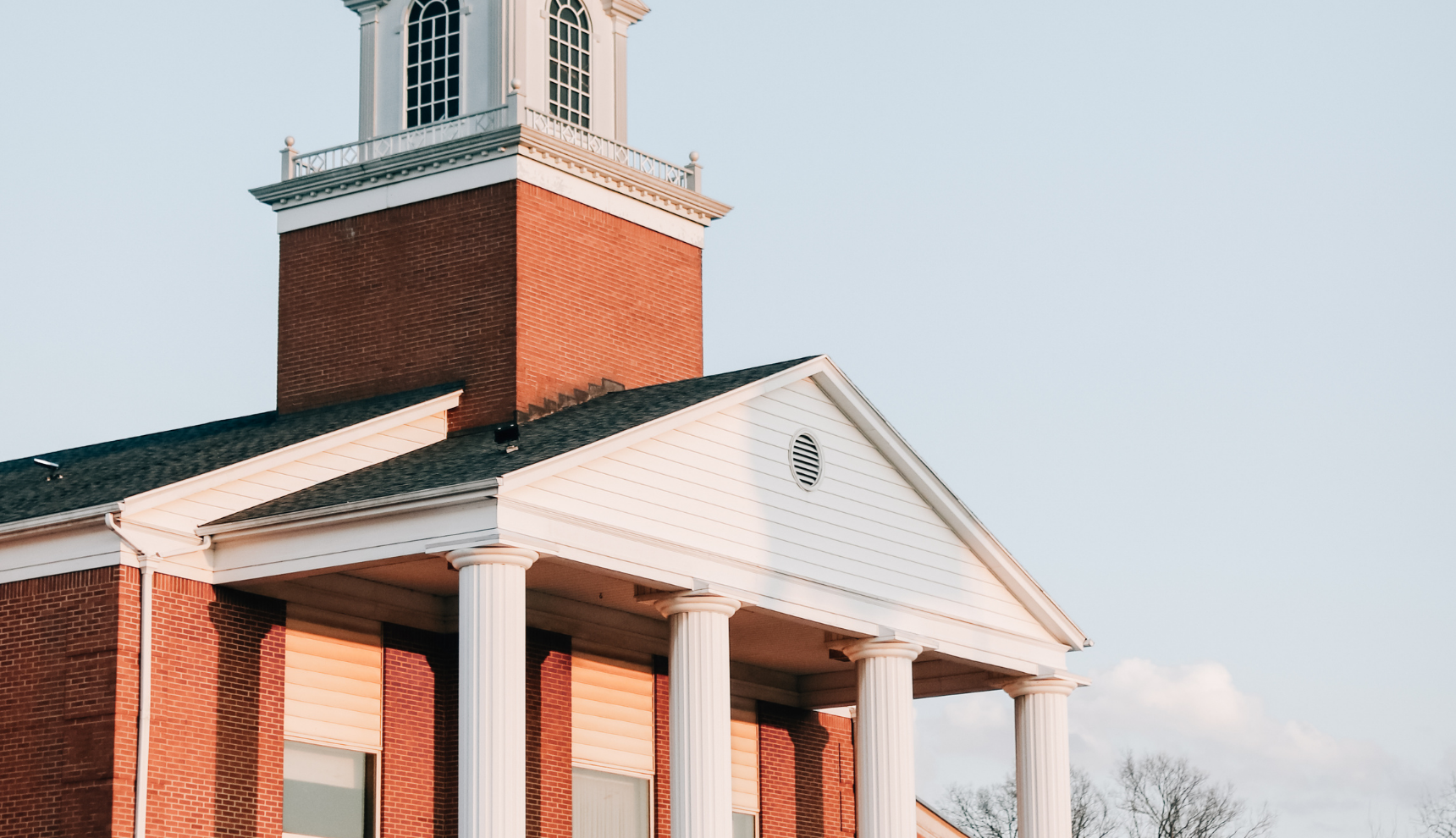 A church in the sunset with a clear blue sky background