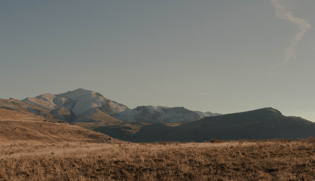 A mountain range in the distance with a clear sky
