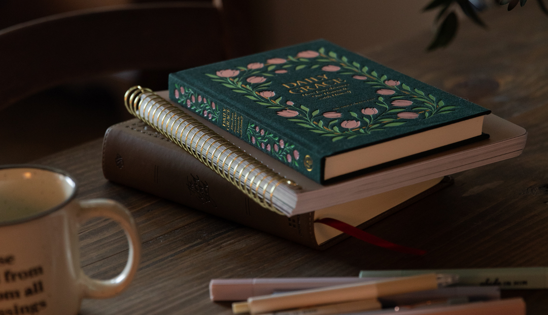 The Daily Grace book on a spiral study on a wooden table