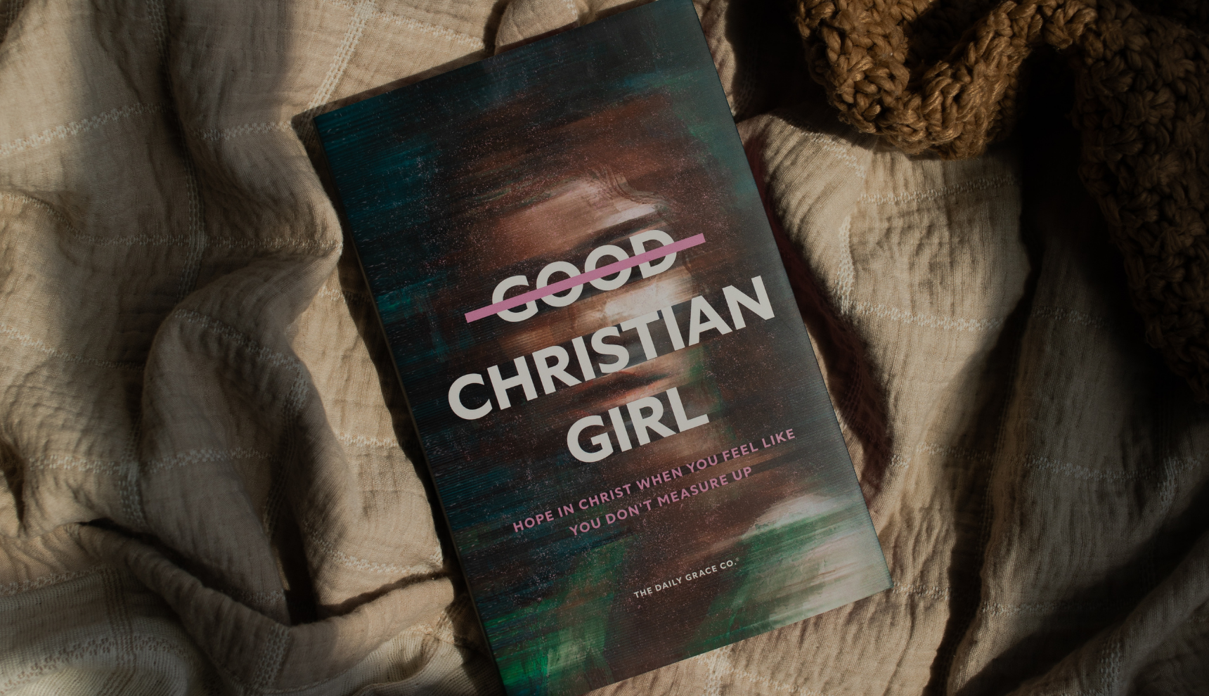 Good Christian Girl Book laying on a solid color blanket