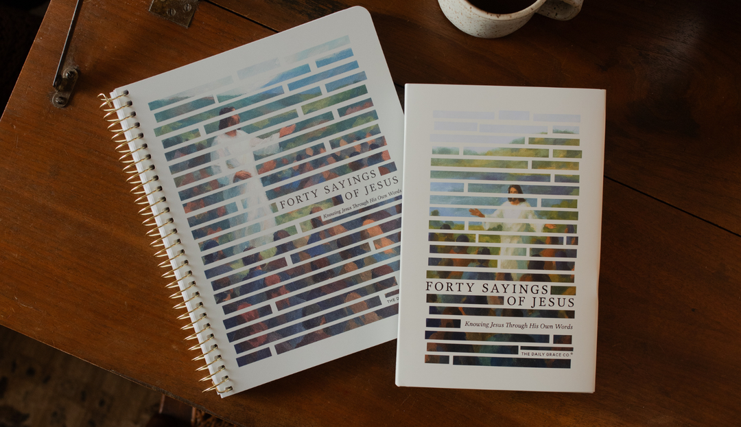 The Forty Sayings of Jesus spiral and book on a wooden table