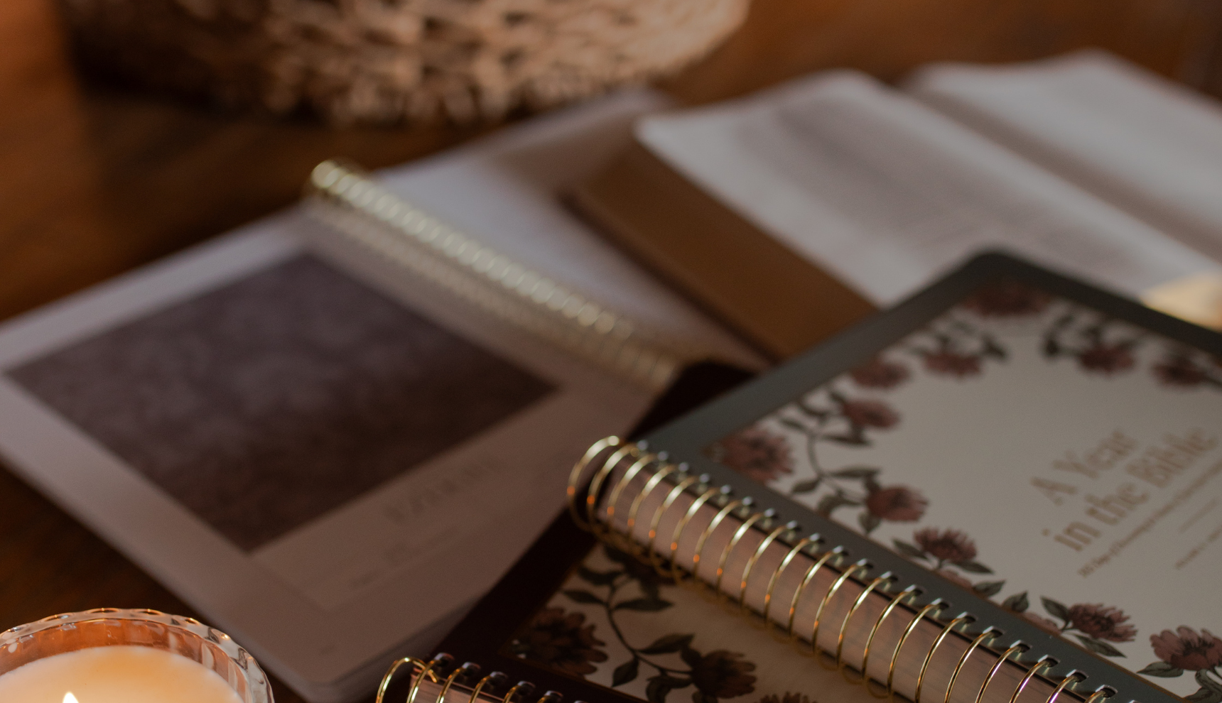 Multiple A Year in the Bible studies sprawled over a desk