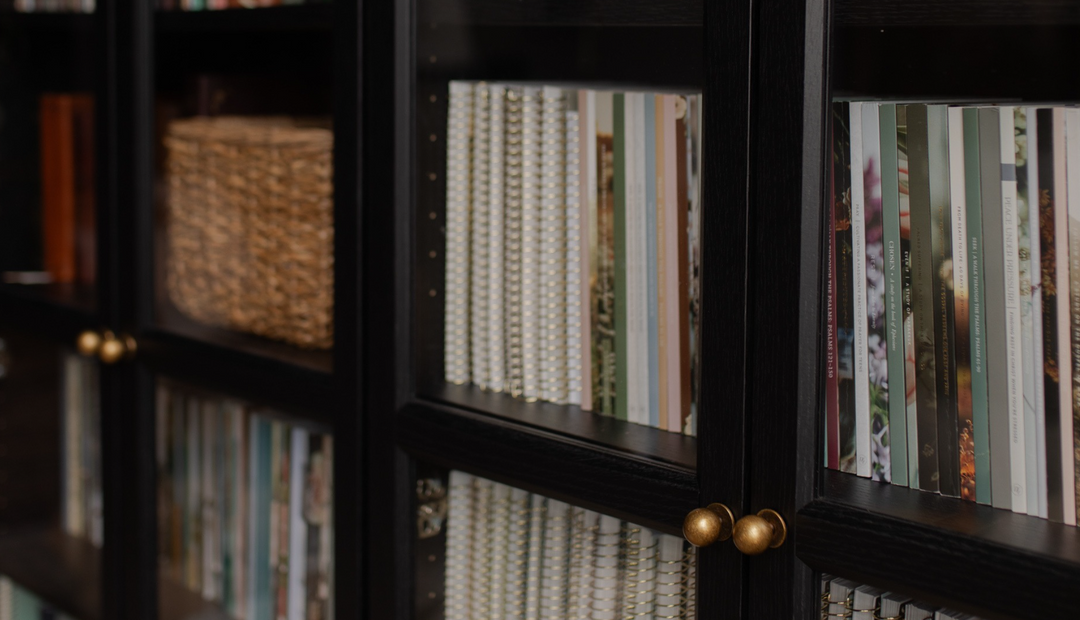 A bookshelf with various Daily Grace Studies