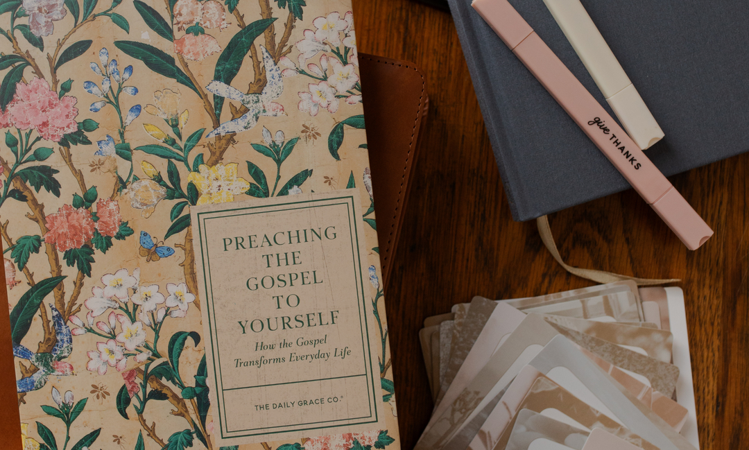 The Preaching the Gospel to Yourself study near some highlighters on a wooden table