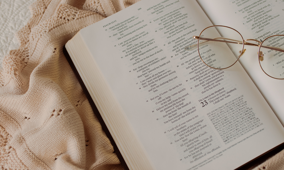 Glasses on an open bible