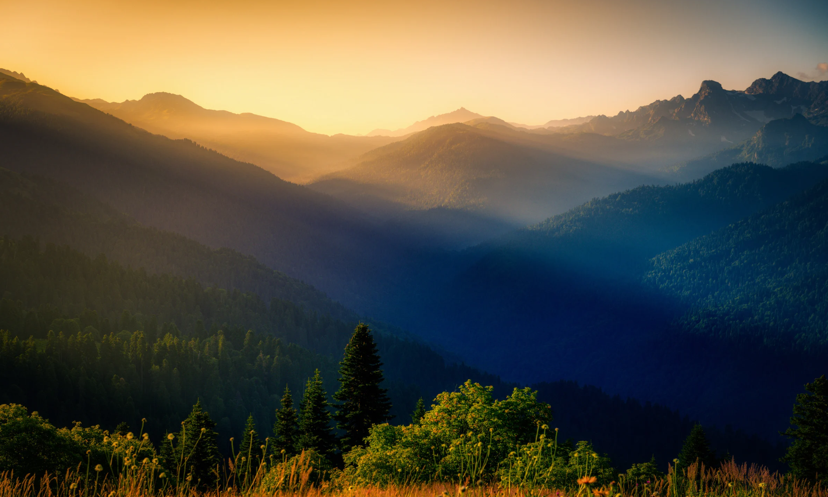 A sunset over a mountain range landscape