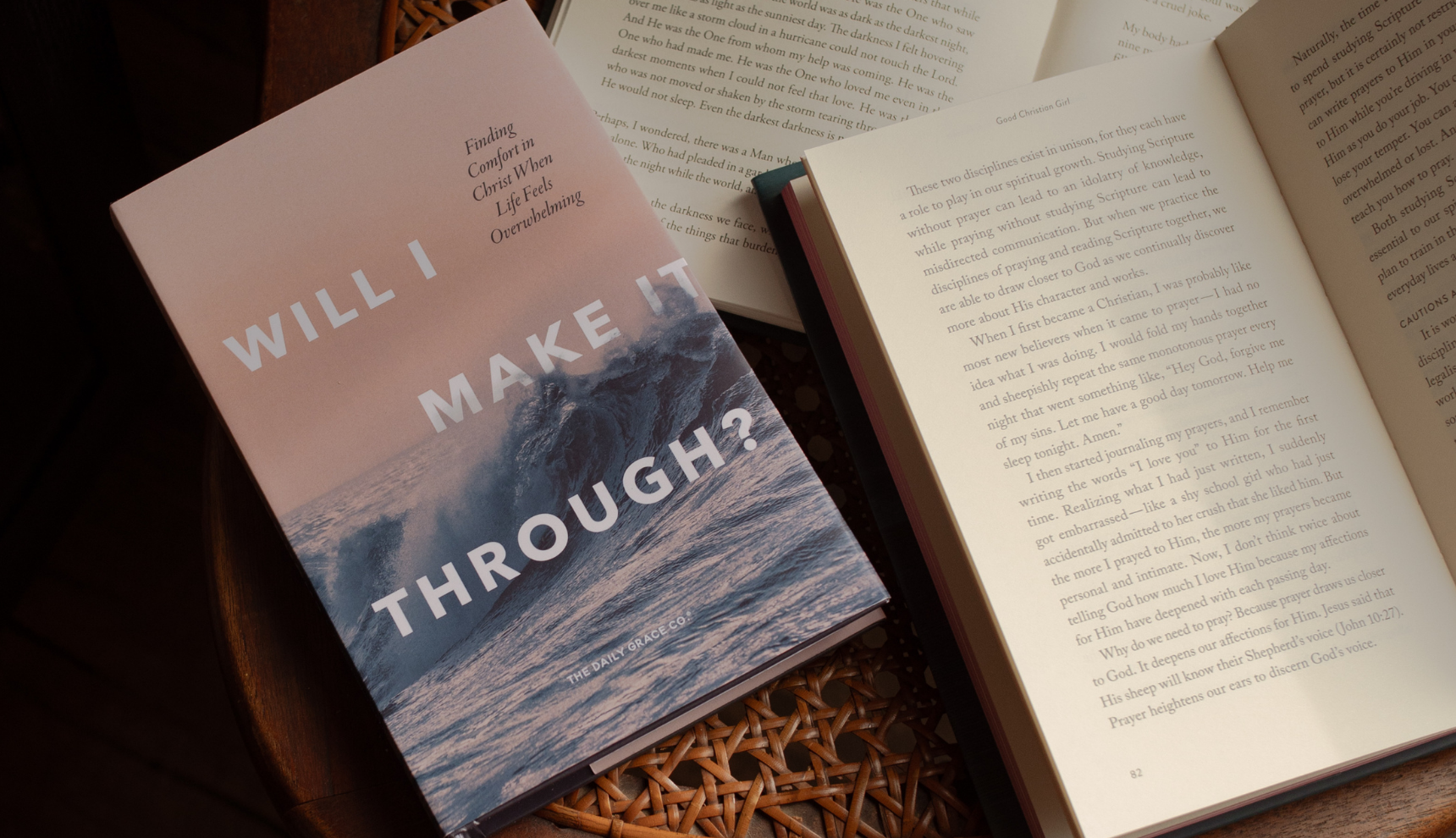 Will I Make It Through? book next to an open copy on a woven chair