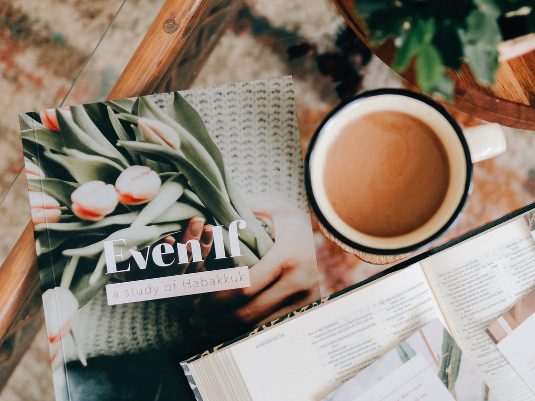 Bible study on book of Haggai on coffee table with Bible and mug