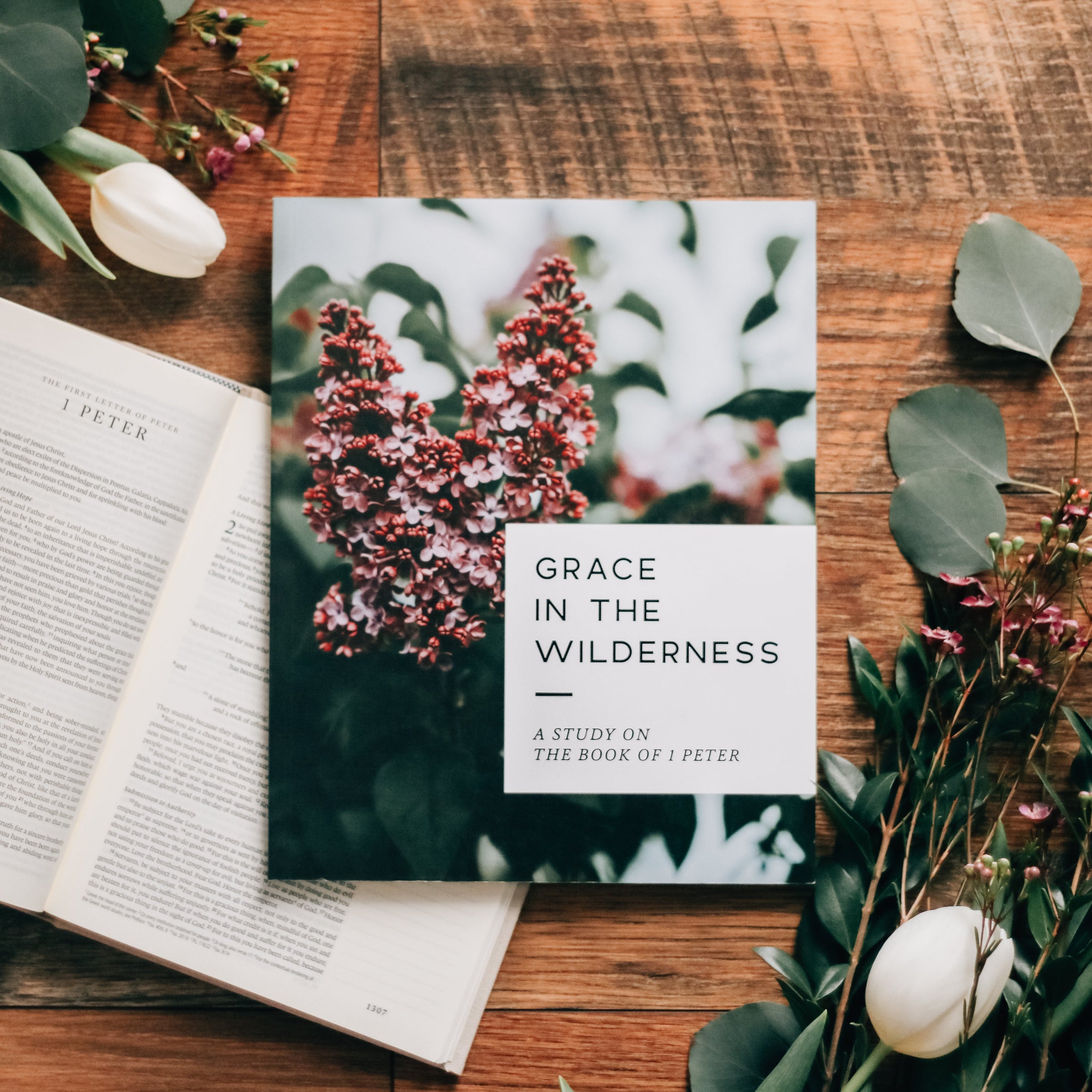 Bible study and Bible on table with flowers.