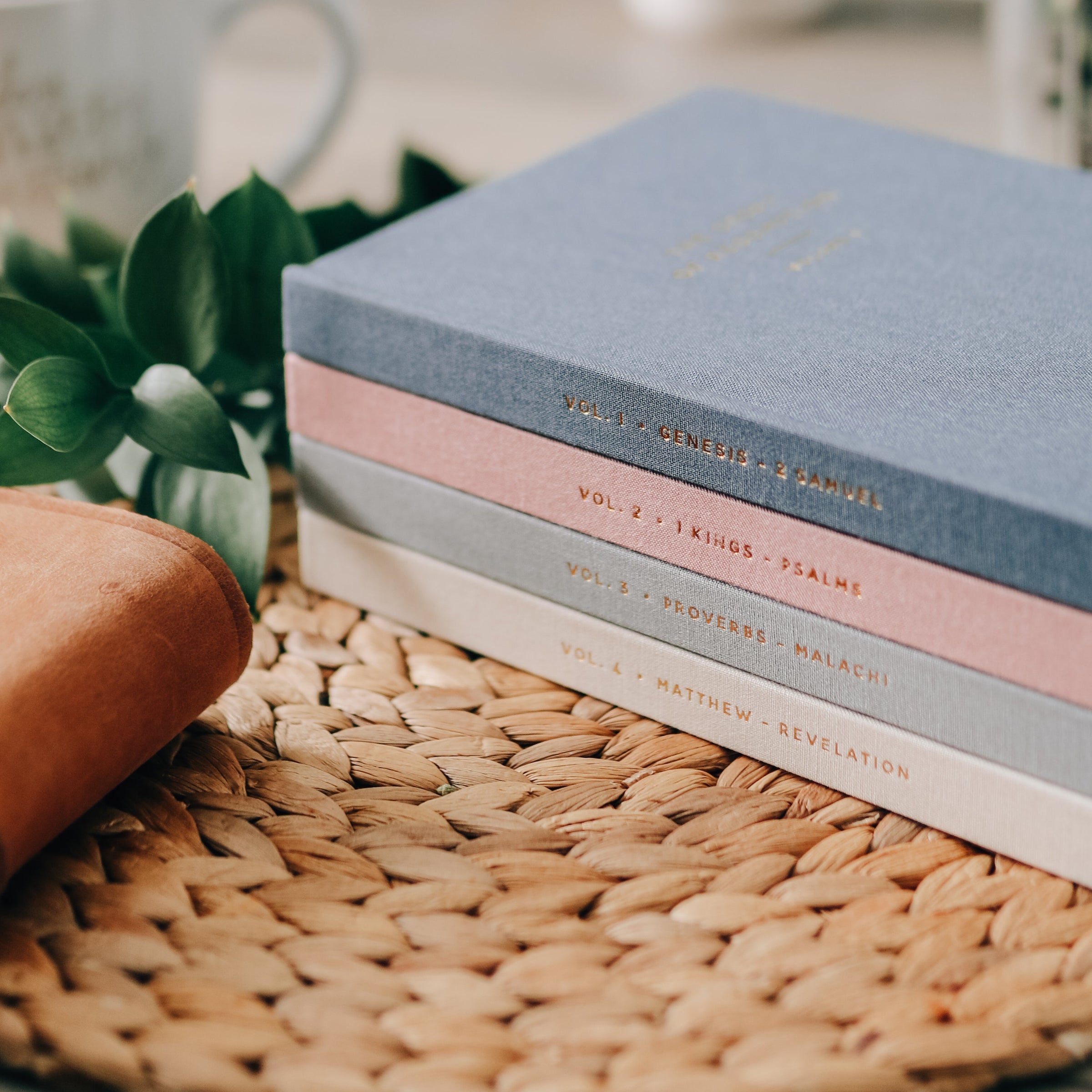 4 journals on wicker placemat.