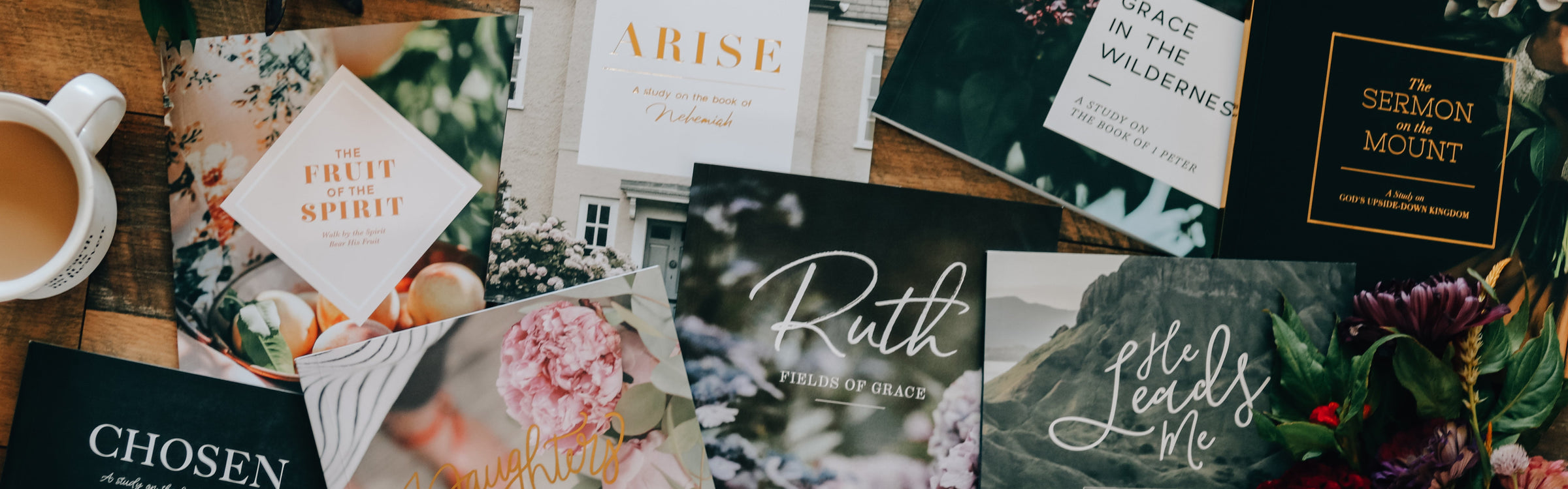 Bible studies scattered on floor with cup of coffee