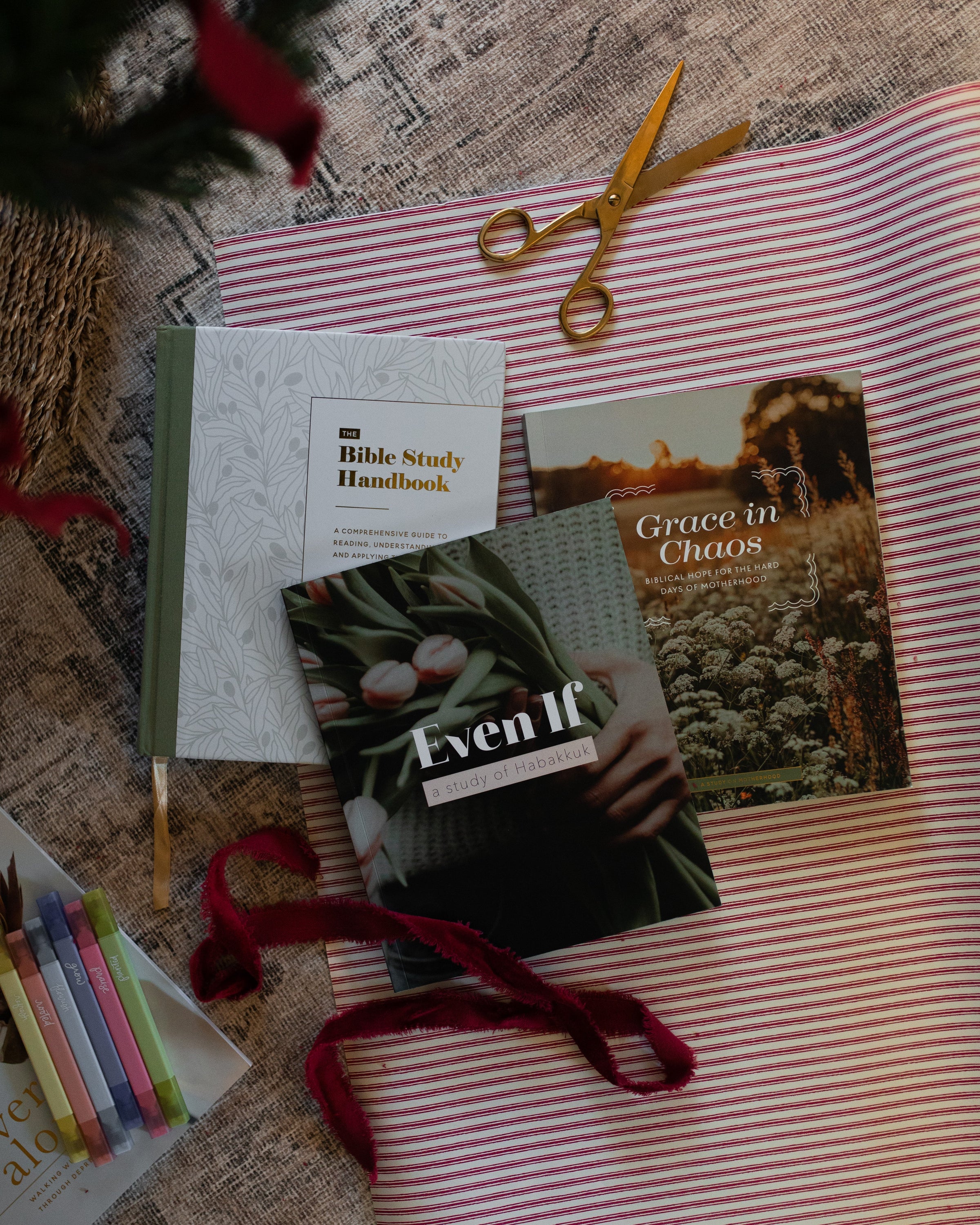 Books on wrapping paper under the Christmas tree