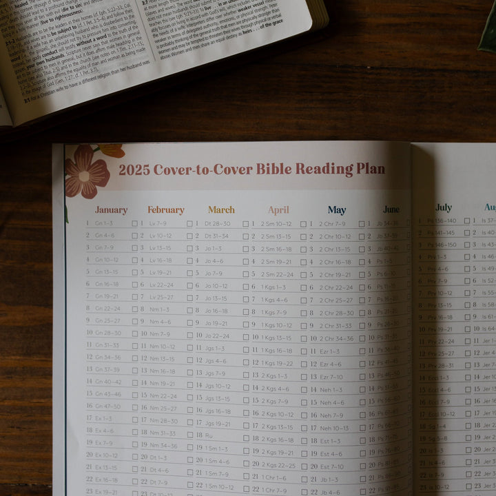 Reading plan page for 2025 prayer calendar open on a table