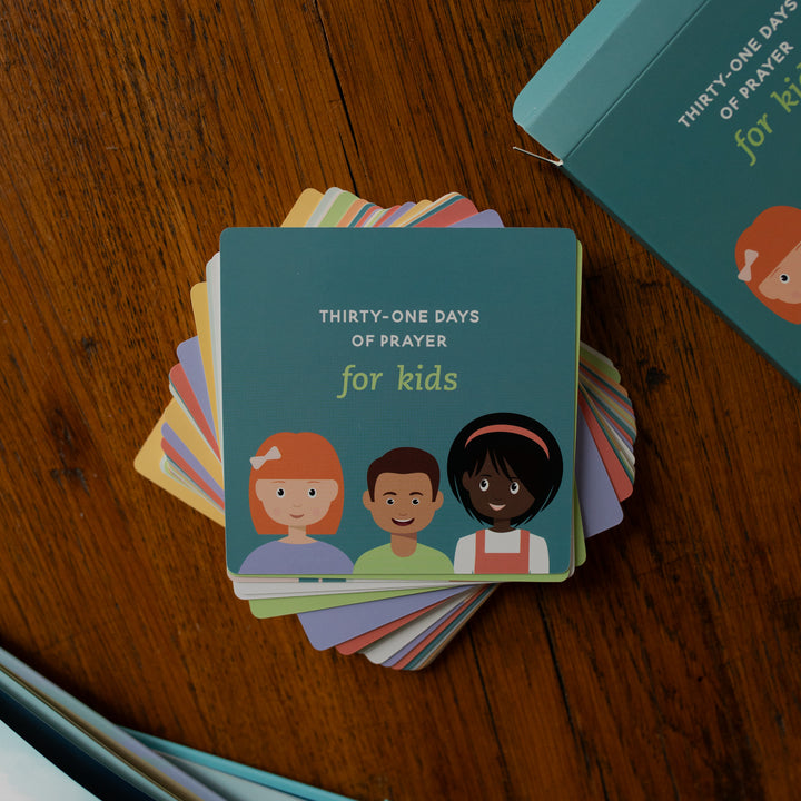 The 31 Days of Prayer for Kids Verse Cards on a wooden table