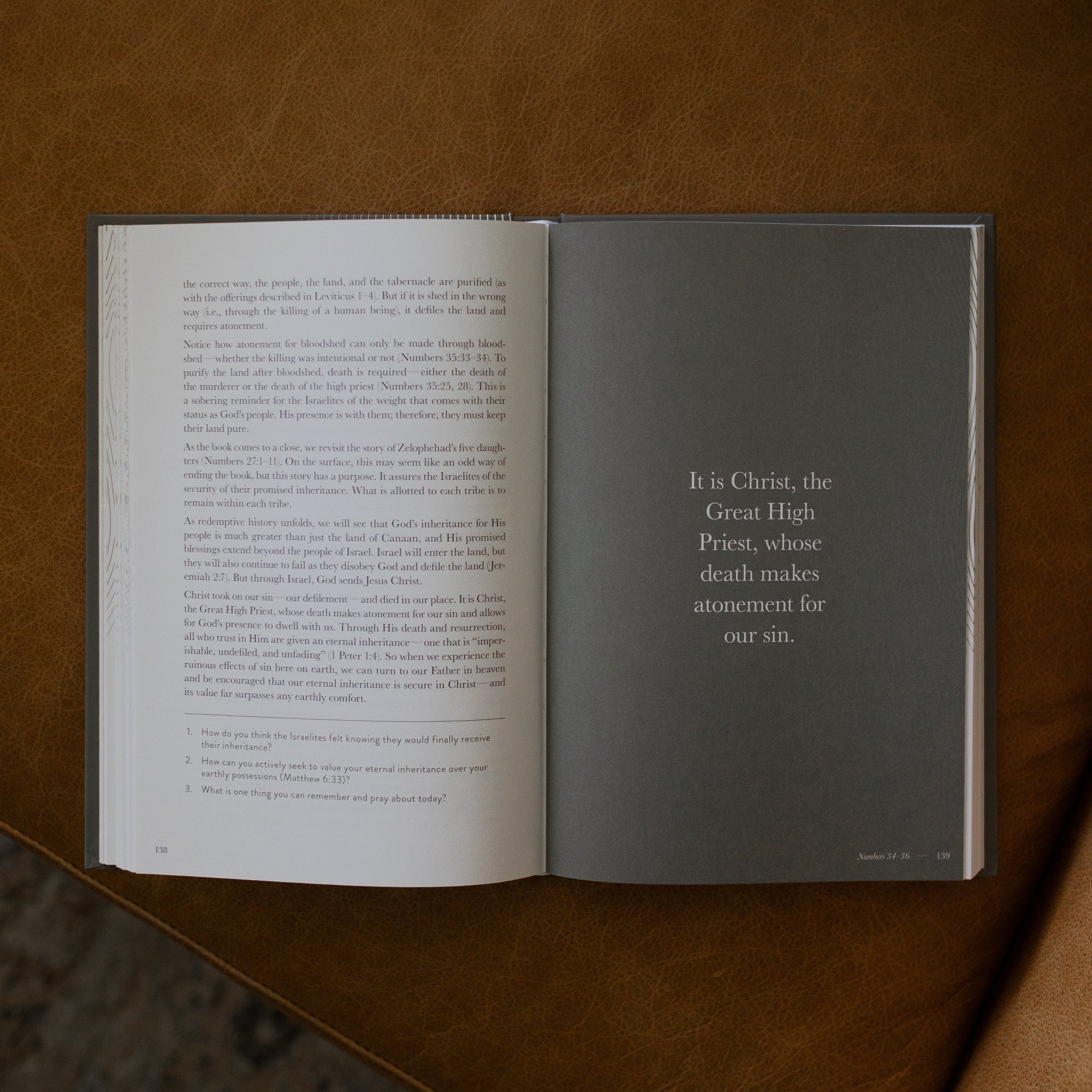 A Year in the Bible Hardcover opened to page 139 on a leather couch