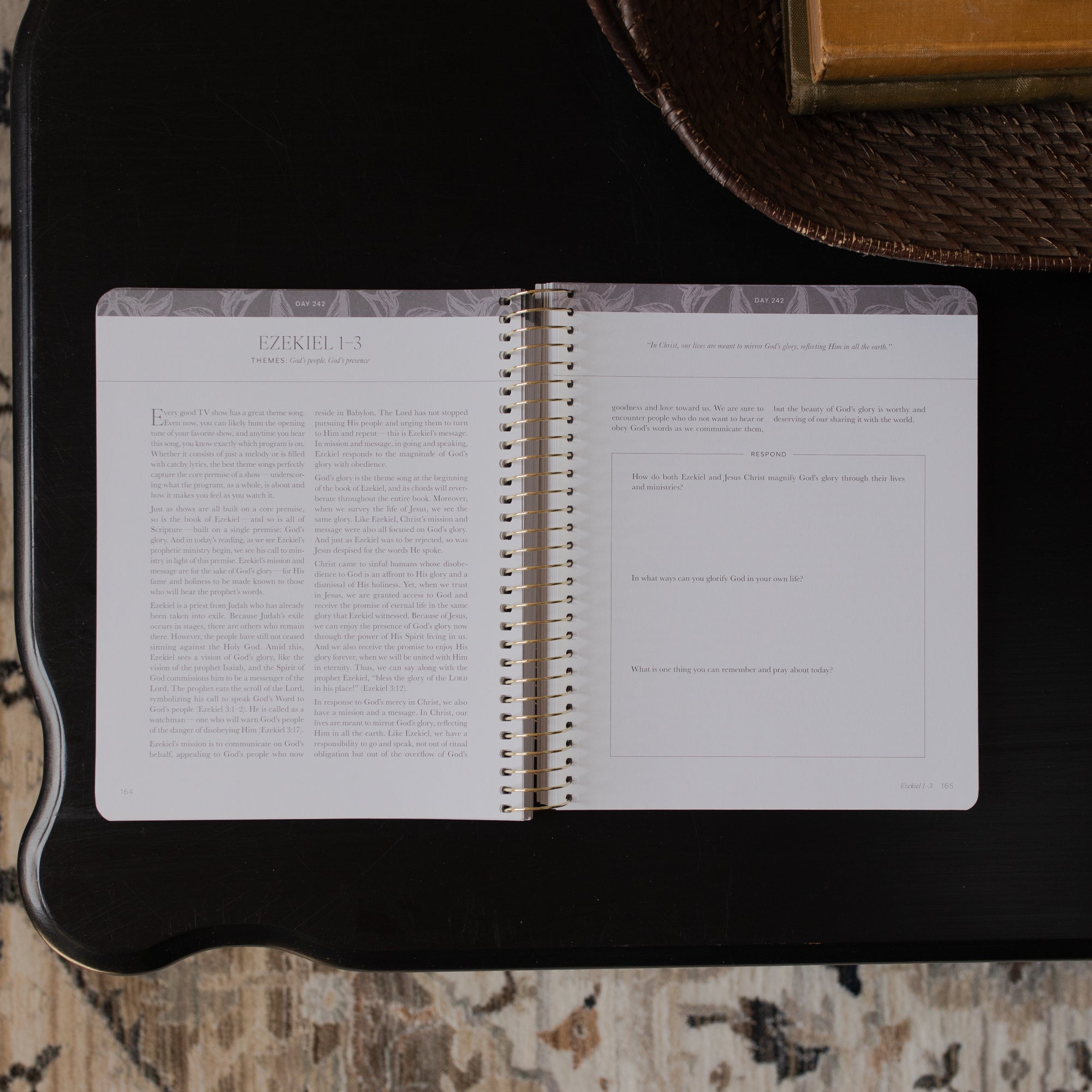 A Year in the bible Vol 3 opened to the Ezekiel content and respond page on a black tabletop