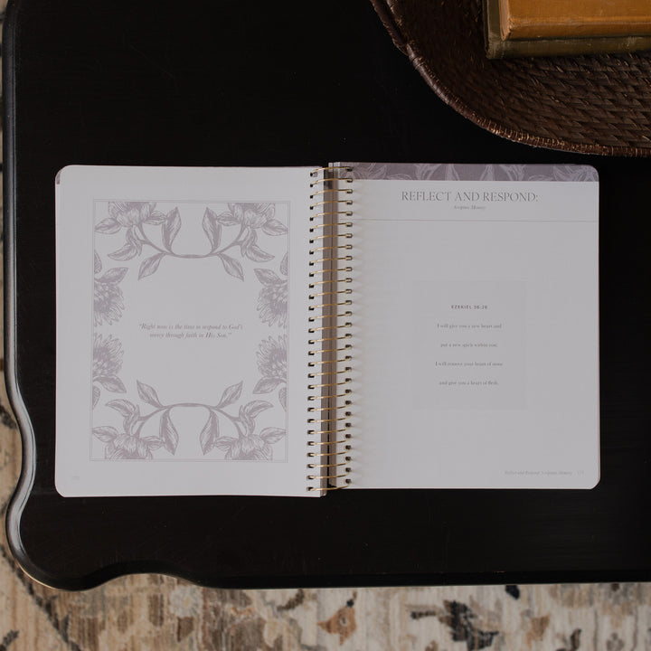 A Year in the bible Vol 3 opened to the Reflect and Respond page on a black tabletop