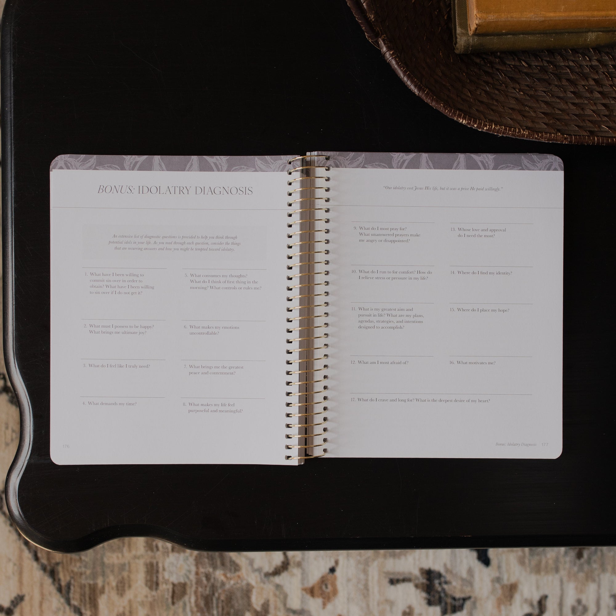 A Year in the bible Vol 3 opened to the Bonus Idolatry Diagnosis page on a black tabletop