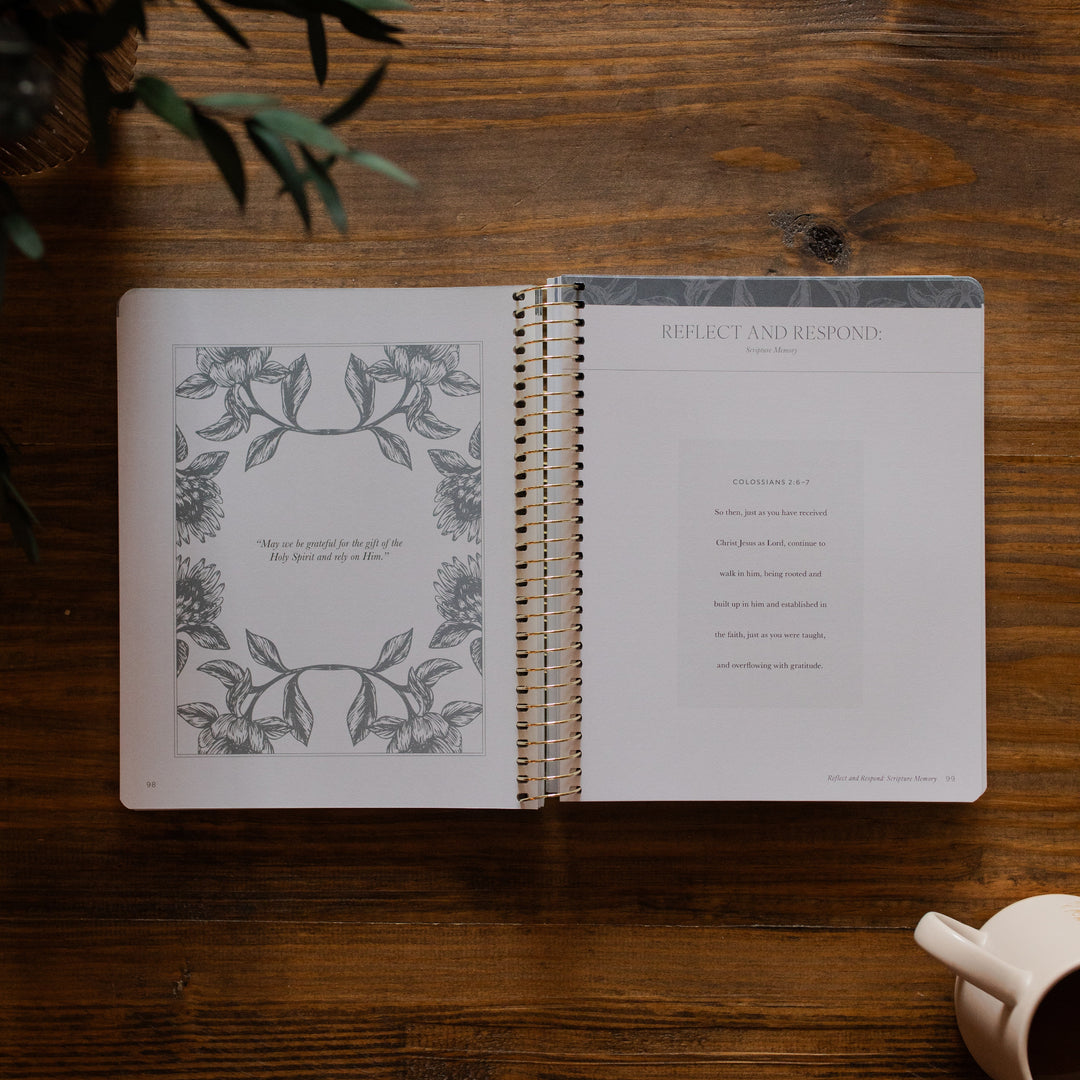 A Year in the Bible Vol 4 opened to the Reflect and Respond page on a wooden table