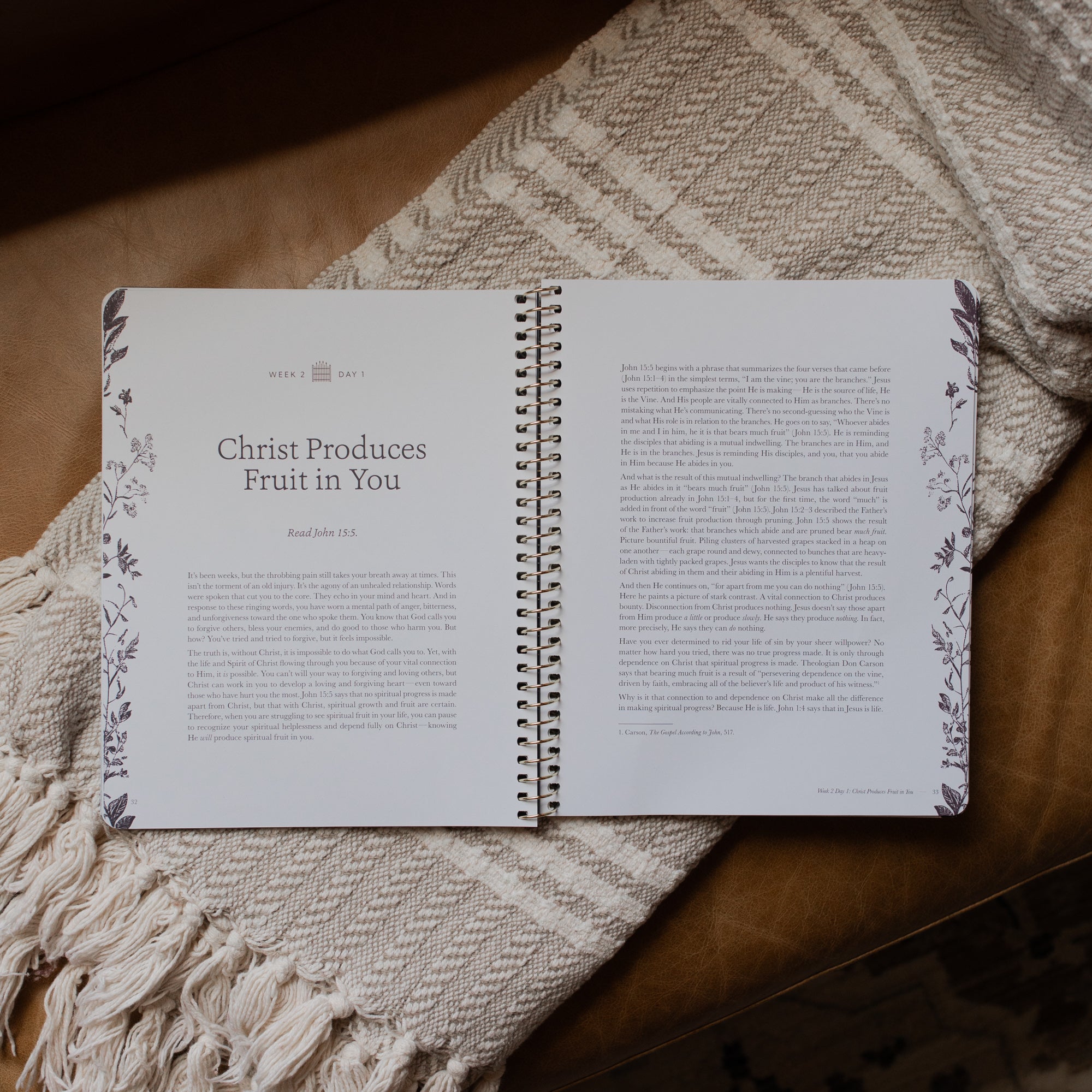 The Abide Spiral opened to the Week 2 Day 1 Reading page on a cream colored blanket
