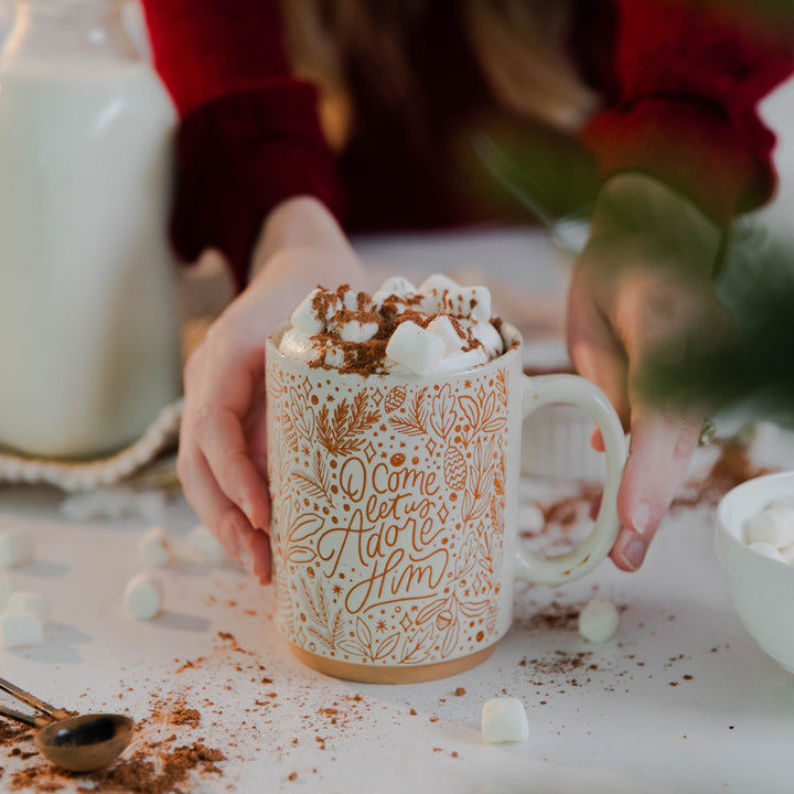 Christian Christmas mug that says O Come Let Us Adore Him with marshmallows 