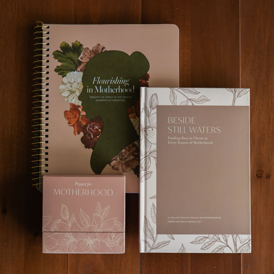 The Essential Motherhood Bundle on a wooden table