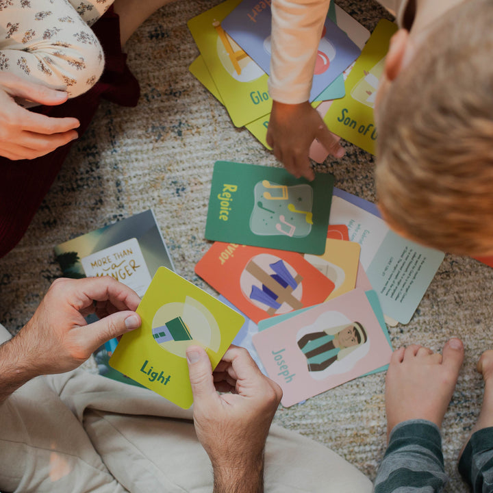 Family looking through Advent Cards for Little Hearts photo side