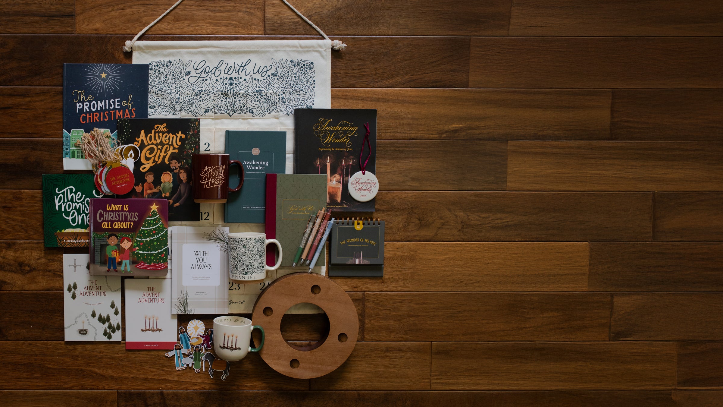The Full Advent Collection laying on a wooden floor